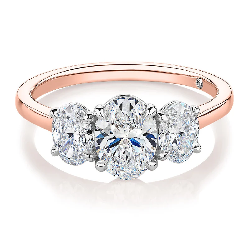 Unique Stackable Rings-Signature Simulant Diamond 1.87 carat* TW oval three stone ring in 14 carat rose and white gold