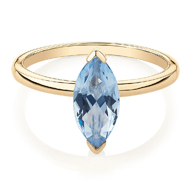 Birthstone Rings for Women-Dress ring with aquamarine simulant in 10 carat yellow gold